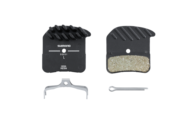 PLAQUETTES DE FREINS ( PAIRE )  SHIMANO RESINE H03A avec ailette et ressort avec goupille fendue (paire)